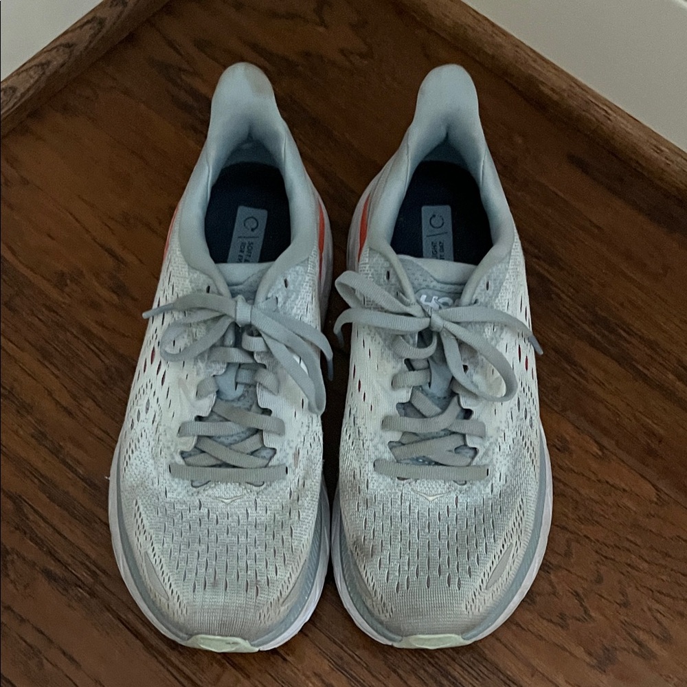 Hoka Light Gray Running Shoes with Coral Heel Accent